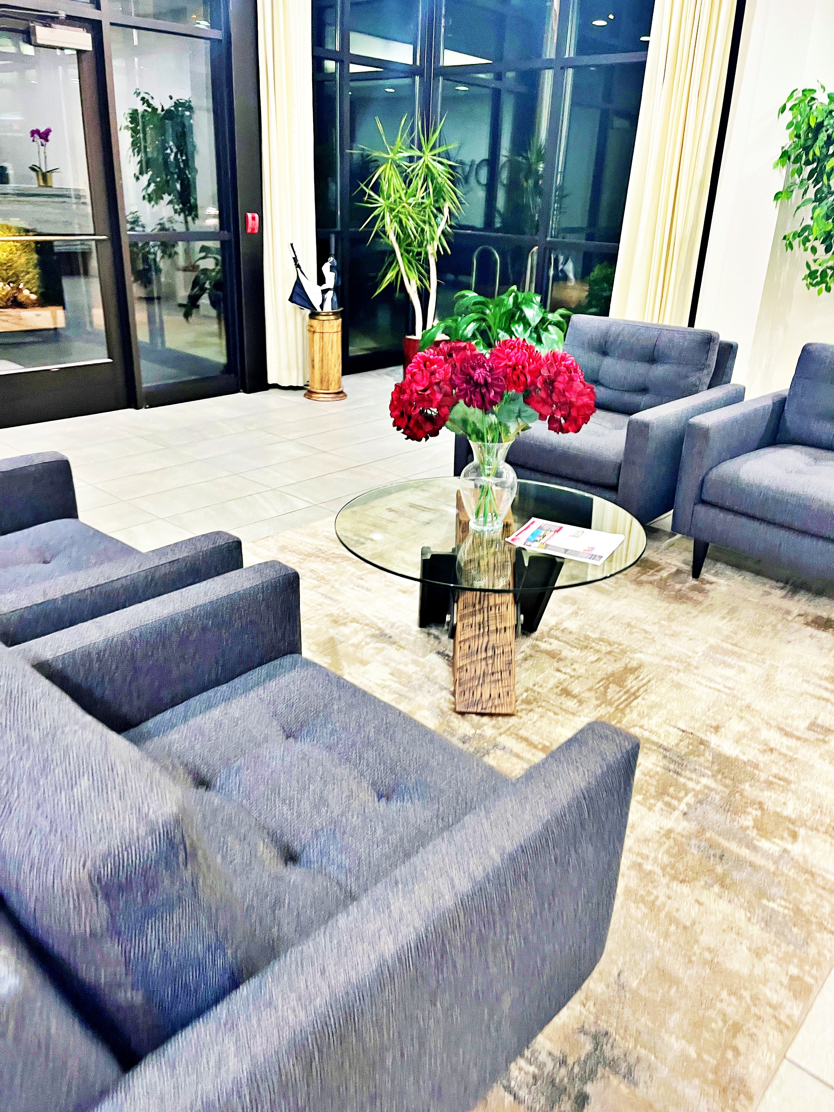 Professional office lobby with fresh flowers and polished tile floors